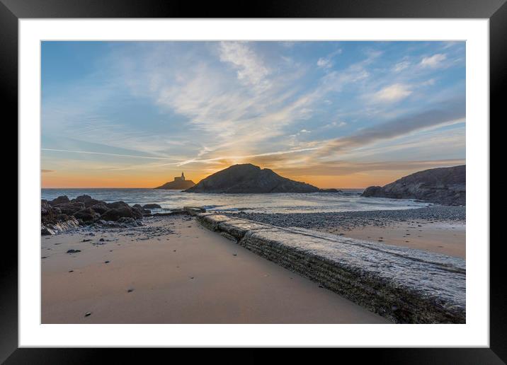 Sunrise at Mumbles lighthouse from the small bay. Framed Mounted Print by Bryn Morgan