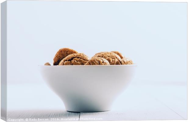 Italian Amaretti Biscuits In White Bowl Canvas Print by Radu Bercan