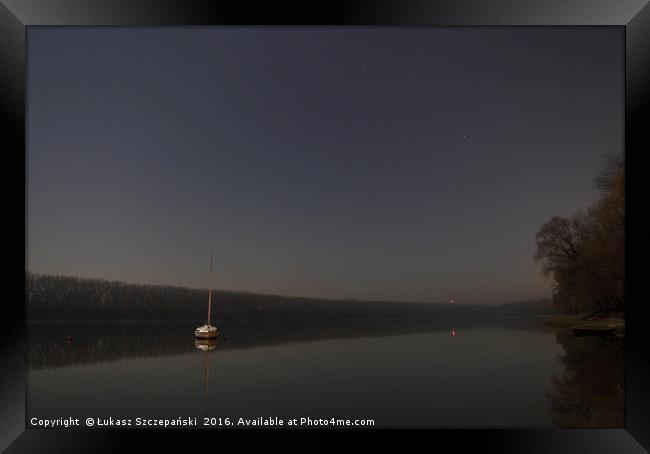 Sail boat on calm lake Framed Print by Łukasz Szczepański