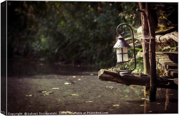 Magic lantern on wooden bridge by the lake Canvas Print by Łukasz Szczepański