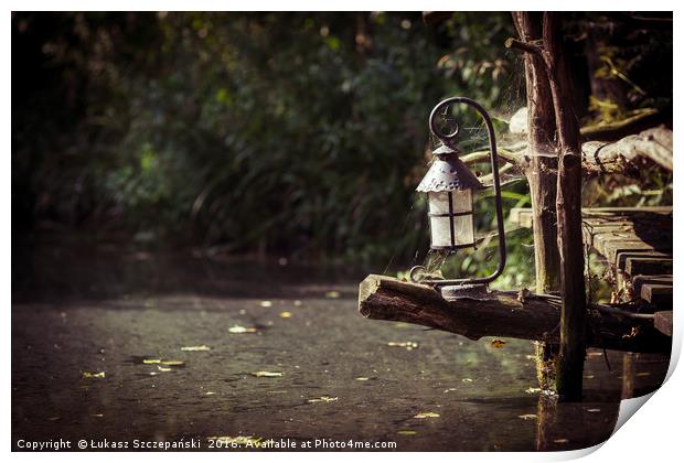 Magic lantern on wooden bridge by the lake Print by Łukasz Szczepański