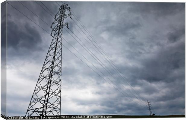 High-voltage power line against dark stormy clouds Canvas Print by Łukasz Szczepański