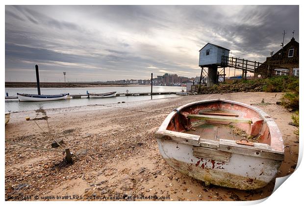 Old rowing boat and lookout tower on beach Print by Simon Bratt LRPS