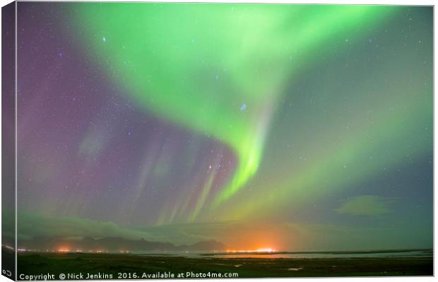 Aurora over south Iceland at the town of Hofn Canvas Print by Nick Jenkins