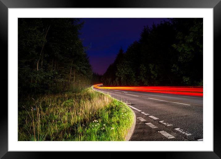 Taillight trail Framed Mounted Print by Garry Quinn