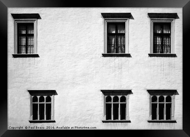 Windows in uneven rows Framed Print by Paul Boazu