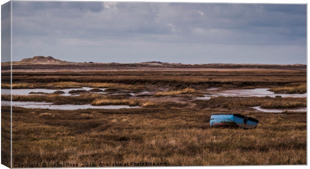 Boat on the salt marsh at Brancaster, Norfolk Canvas Print by Nichol Pope