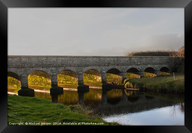 Winter sunlight through a small bridge Framed Print by Michael Harper