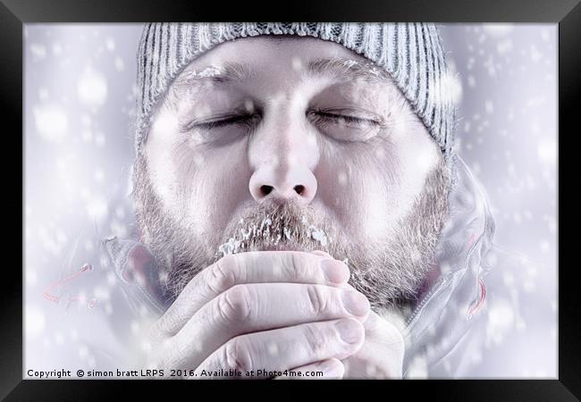 Man freezing in snow storm white out close up Framed Print by Simon Bratt LRPS