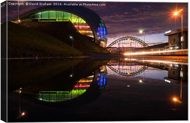 Sage Gateshead & Tyne Bridge reflected in puddle Canvas Print by David Graham