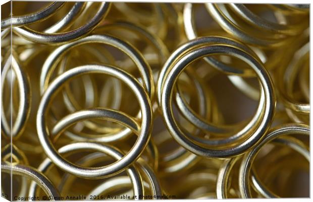 Gold Rings Canvas Print by Simon Annable