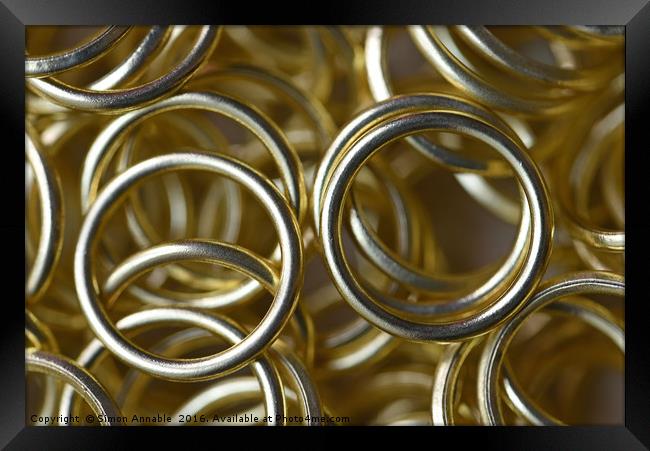Gold Rings Framed Print by Simon Annable