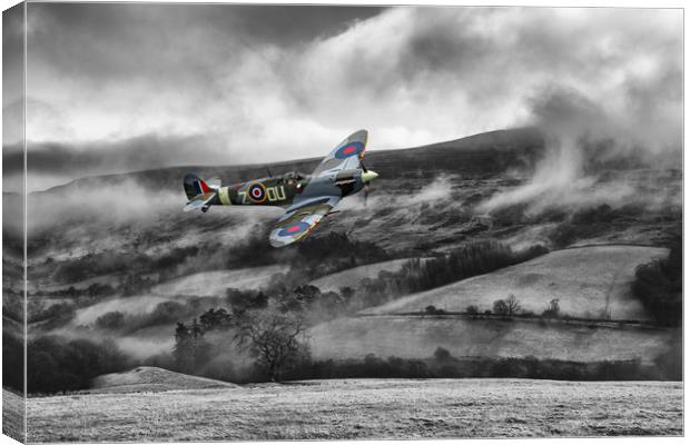 Spitfire Low Cloud Canvas Print by J Biggadike