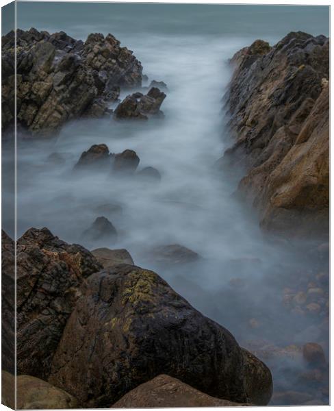 Misty water at Rotherslade bay. Canvas Print by Bryn Morgan