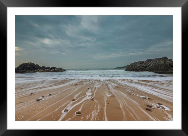 Pebbles on the beach at Rotherslade bay. Framed Mounted Print by Bryn Morgan