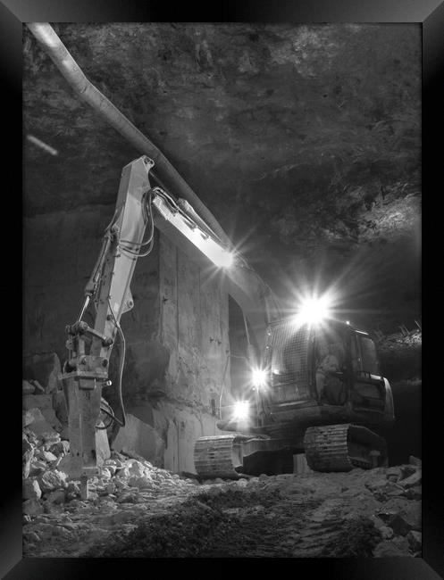 At work in the mines Framed Print by James Ford