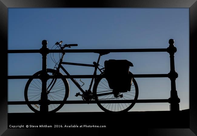 Bicycle against railings, sllhouette.  Framed Print by Steve Whitham