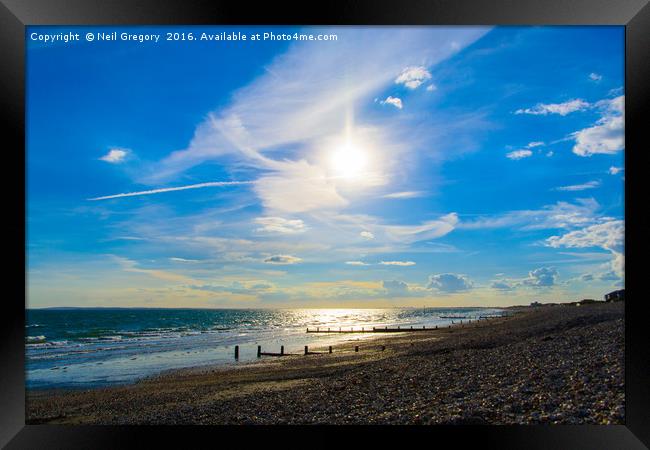 Beach Sun Set with Bright Blue Sky Framed Print by Neil Gregory