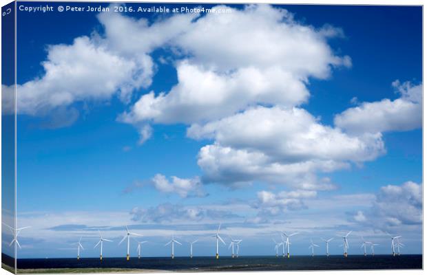   Offshore wind farm under a blue sky and white  c Canvas Print by Peter Jordan