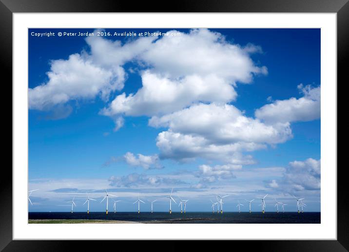   Offshore wind farm under a blue sky and white  c Framed Mounted Print by Peter Jordan