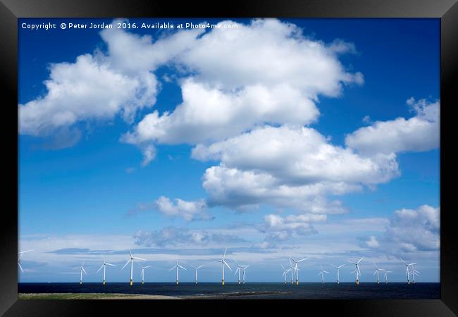   Offshore wind farm under a blue sky and white  c Framed Print by Peter Jordan