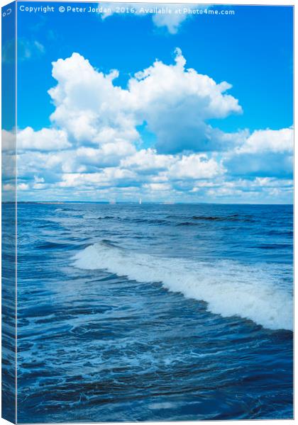 North Sea spring sunshine blue sky  with cumulus c Canvas Print by Peter Jordan
