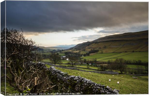 Dark Clouds over Kettlewell Canvas Print by Gary Turner