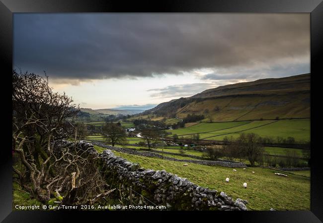 Dark Clouds over Kettlewell Framed Print by Gary Turner