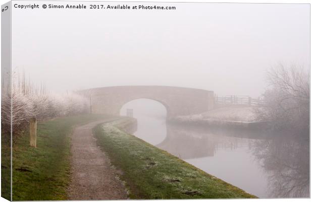 Misty Canal Scene Canvas Print by Simon Annable