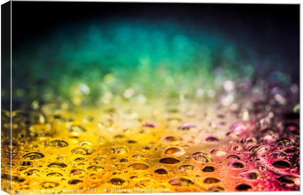 Rainbow water drops with refracted illumination. Canvas Print by Steve Whitham