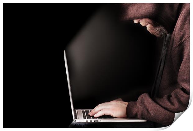 Hooded computer hacker using laptop Print by Simon Bratt LRPS