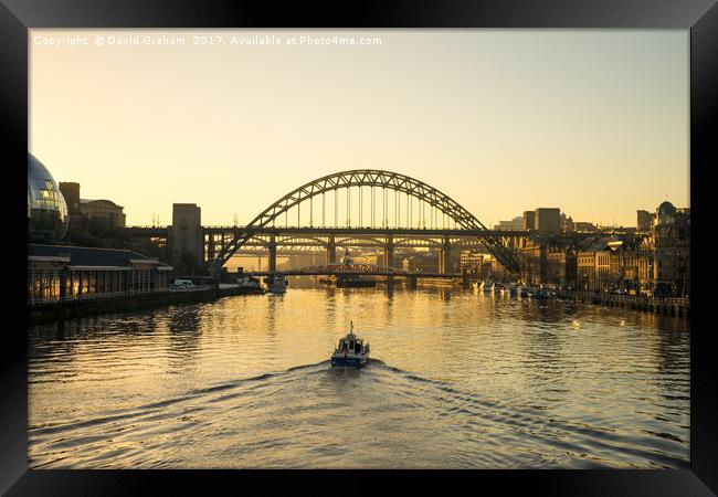 Tyne Bridge at sunset - Boat on water Framed Print by David Graham