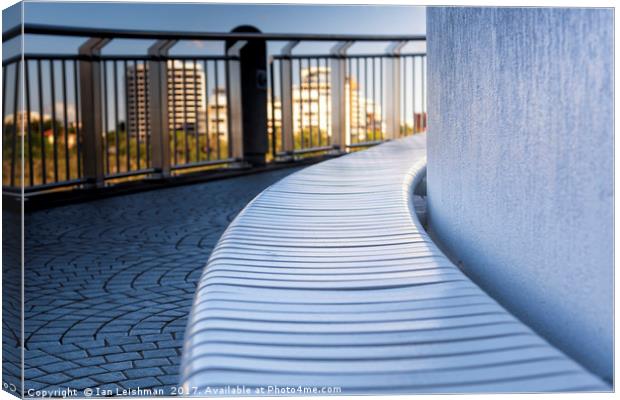 Curved riverwalk seat in shade Canvas Print by Ian Leishman