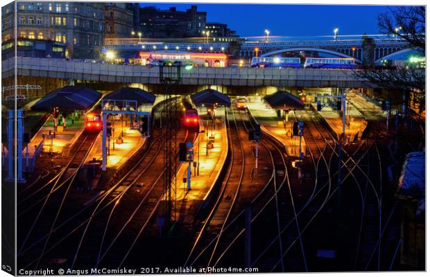 Edinburgh Waverley Station by night Canvas Print by Angus McComiskey