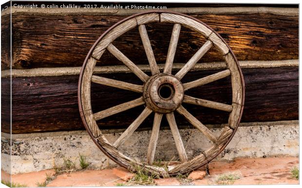 Old Wagon Wheel - Cody, Wyoming Canvas Print by colin chalkley