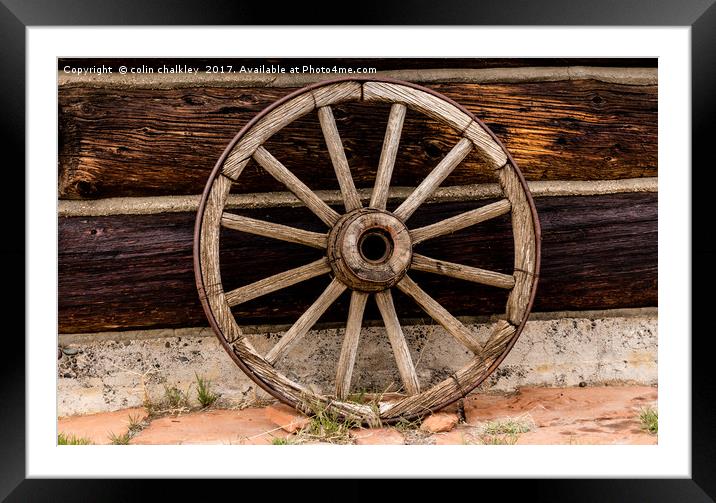 Old Wagon Wheel - Cody, Wyoming Framed Mounted Print by colin chalkley