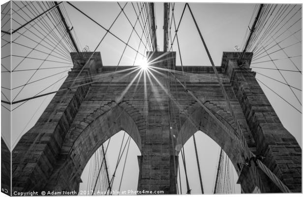 Sun behind Brooklyn Bridge, New York Canvas Print by Adam North