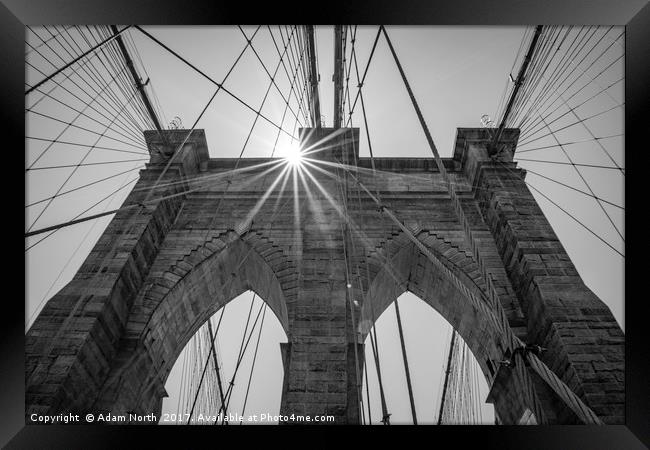 Sun behind Brooklyn Bridge, New York Framed Print by Adam North