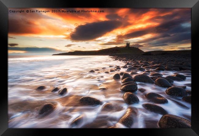 Sunrise Over Dunstanburgh Castle Framed Print by Ian Flanagan
