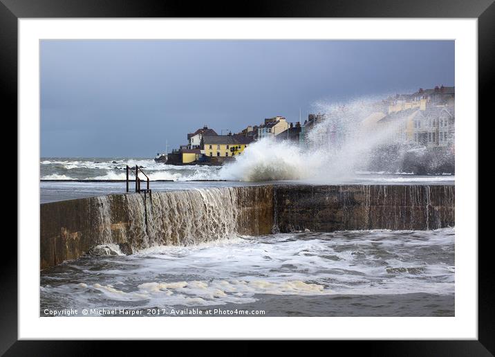 A winter storm buffets the pier at the Long Hole Framed Mounted Print by Michael Harper