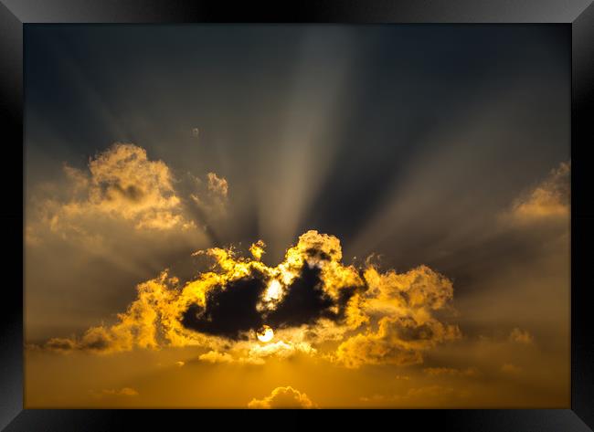 The Sun and Clouds Framed Print by Hassan Najmy