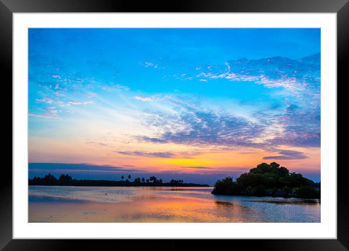 Islands in the dusk Framed Mounted Print by Hassan Najmy