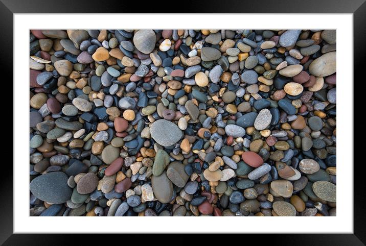 Pebbles of many shapes, colours and sizes. Framed Mounted Print by Bryn Morgan
