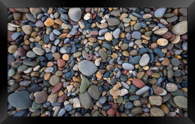 Pebbles of many shapes, colours and sizes. Framed Print by Bryn Morgan