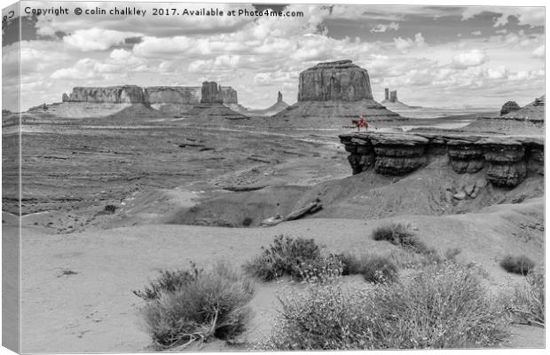 A Lone Horseman in Monument Valley Canvas Print by colin chalkley