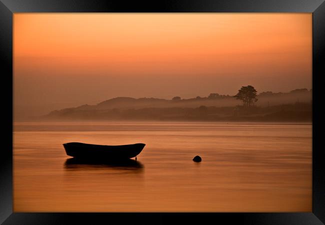 Rowing boat at rest on the river at sunrise Framed Print by Lindsay Philp