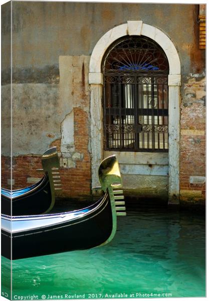 Gondola and arched doorway Canvas Print by James Rowland