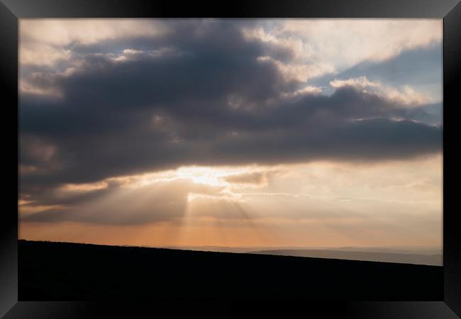 Sunset through storm clouds. Beeley Moor, Derbyshi Framed Print by Liam Grant