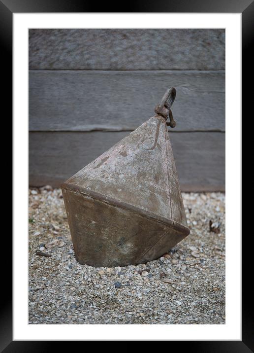 Old metal buoy on shingle. Framed Mounted Print by Bryn Morgan