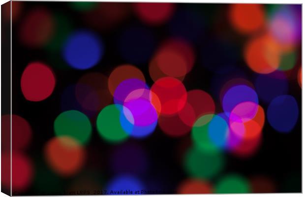 Large coloured party lights at night Canvas Print by Simon Bratt LRPS